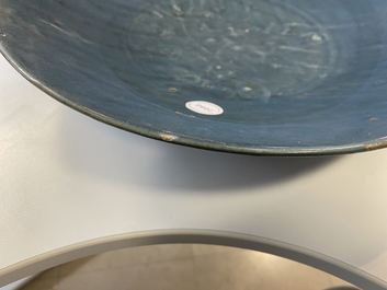 A Chinese monochrome blue Swatow dish with incised carp design, Ming